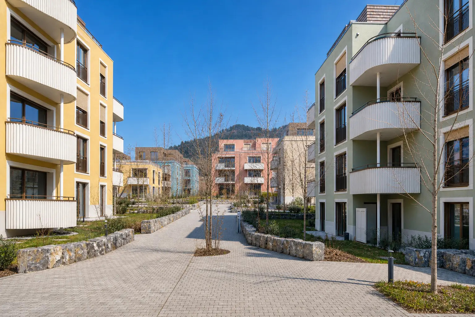 Professionelle Immobilienfotografie einer modernen Wohnüberbauung mit Mehrfamilienhäusern und gepflegten Aussenanlagen in Seewen Schwyz